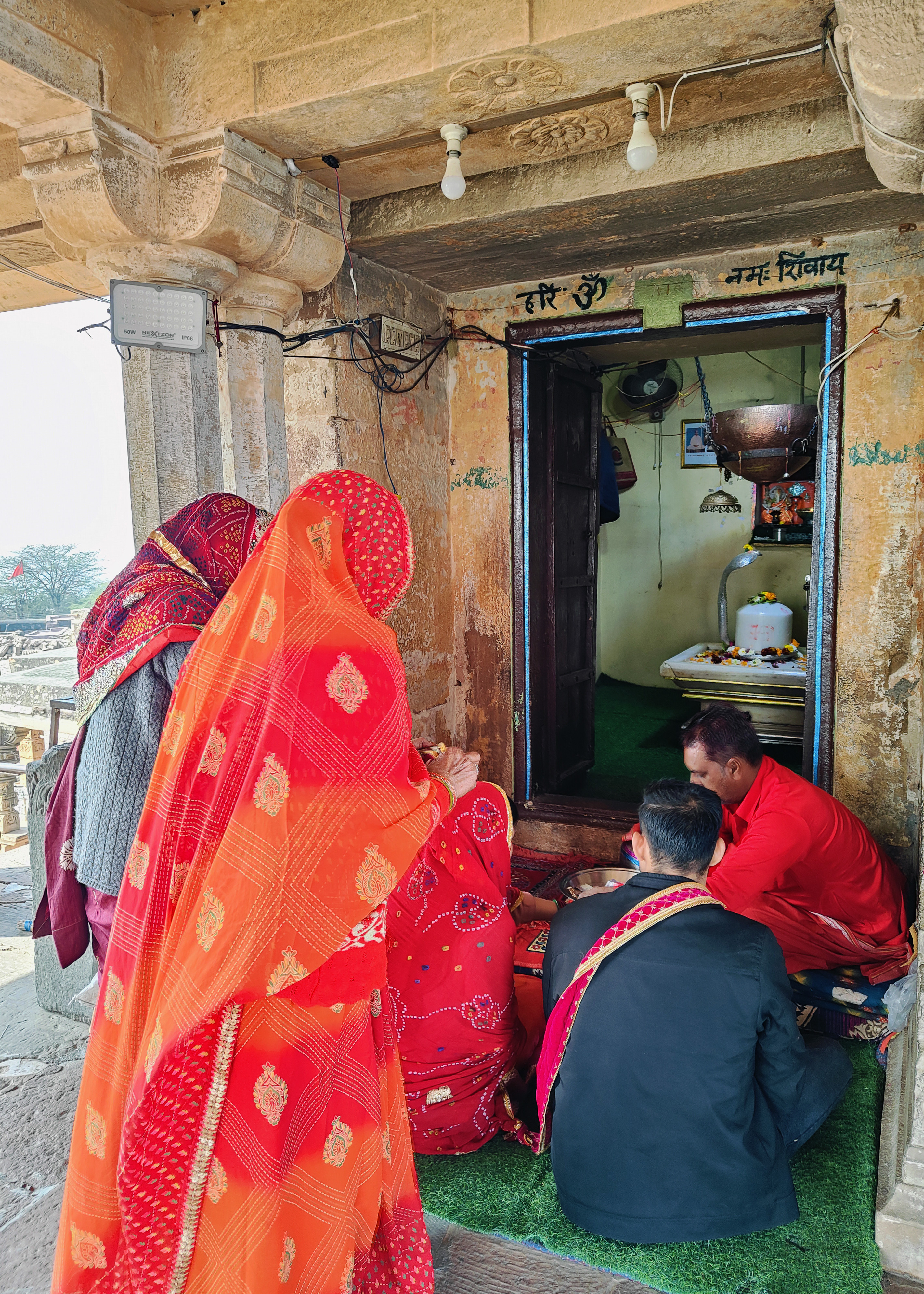 Image 7: Locals performing ceremonies at the shrine after marriage inside the 18th century CE Shiva temple.