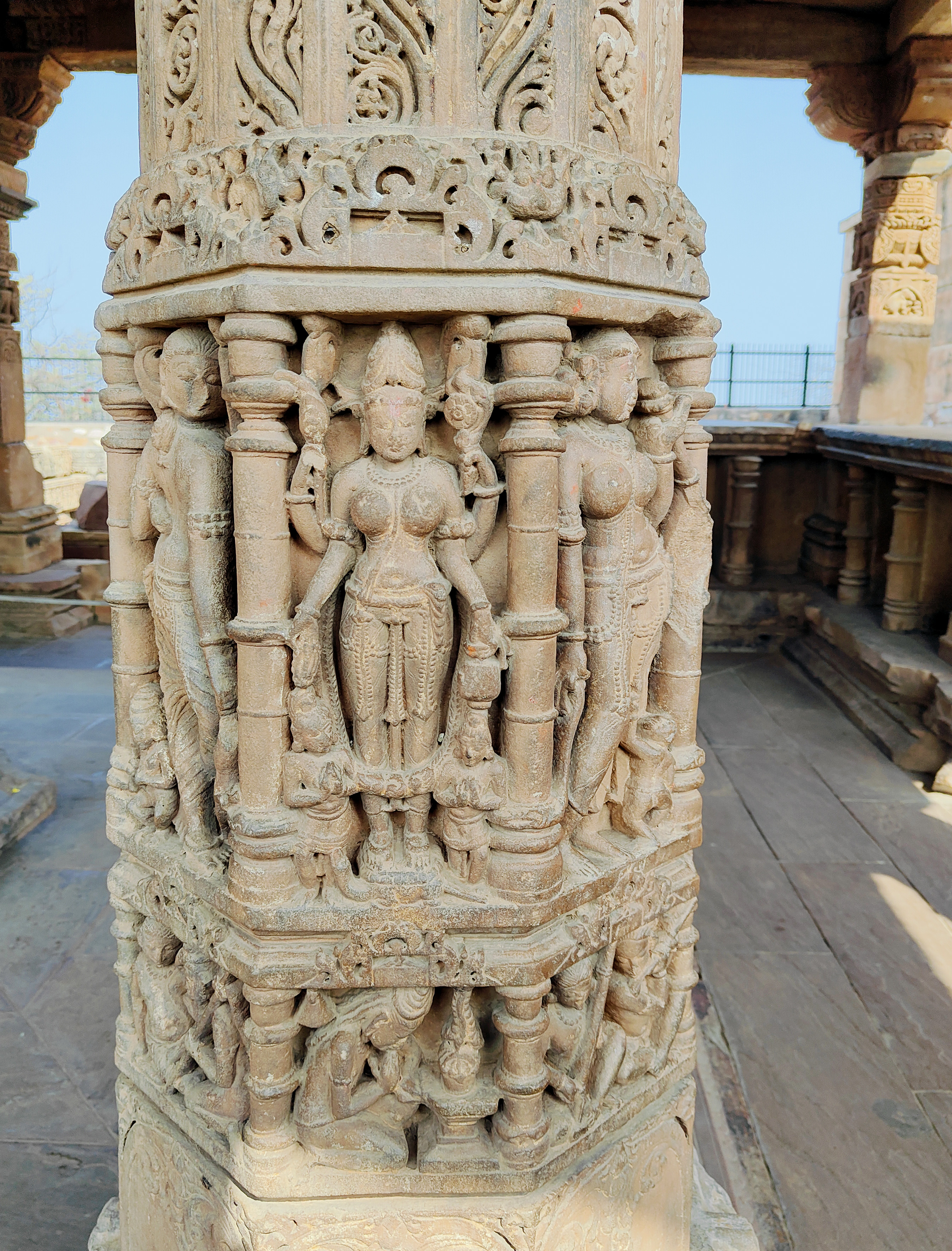 Image 9: Beautiful images of apsaras and female deities, such as Parvati, adorn the pillars in the niches of the Harsha Temple's mandapa. These female figurines correspond to the plethora of female figurines (Parvati and damsels) depicted on the walls inside the sanctum. Beneath these pillar niches are panels depicting musicians, dancers, celestial beings, deities like Ganesha, and ascetics. 