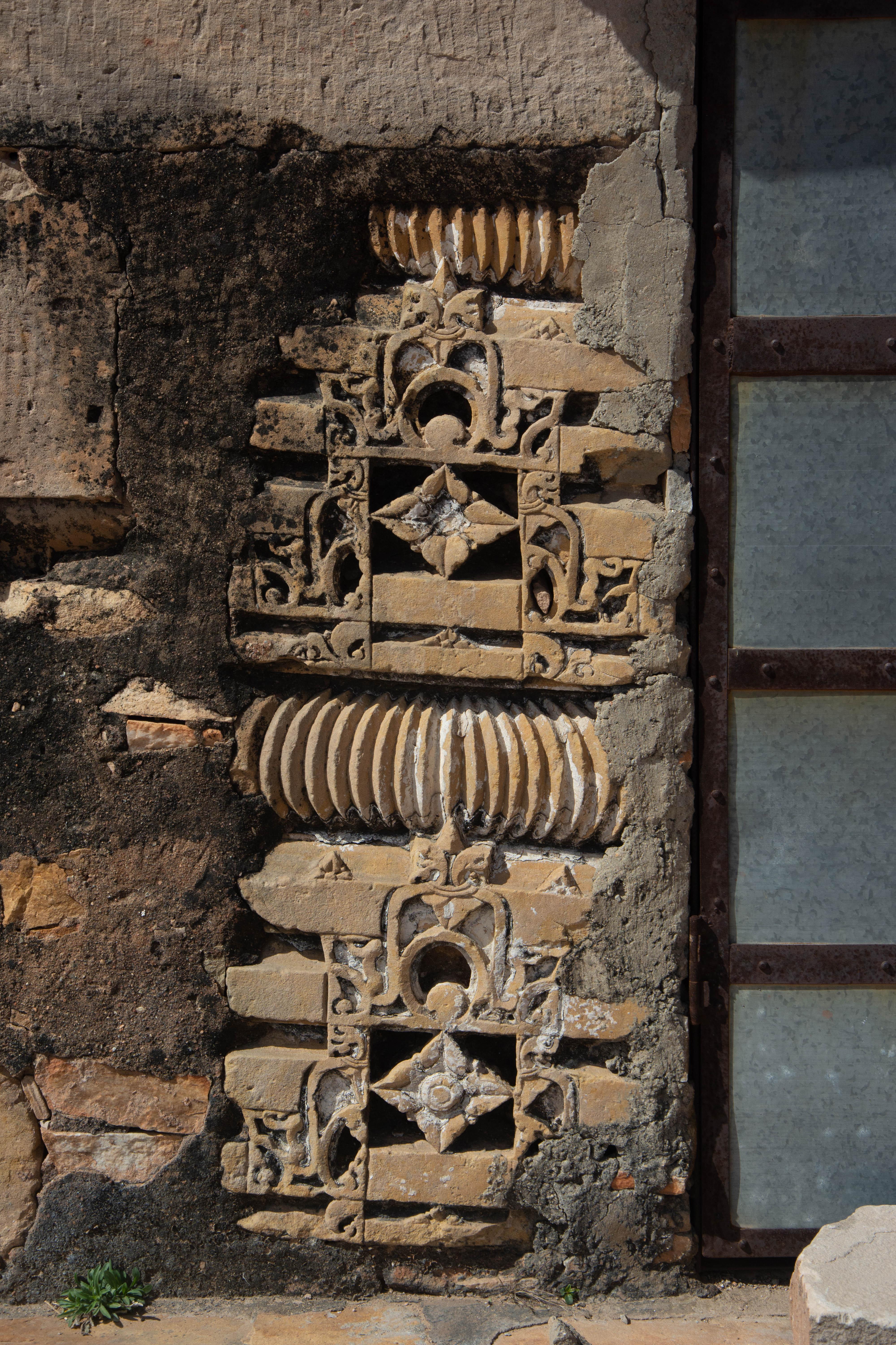 Fragments of a superstructure, featuring two bhumis and an amalaka, were affixed on a late mediaeval structure on Harsha Hill.