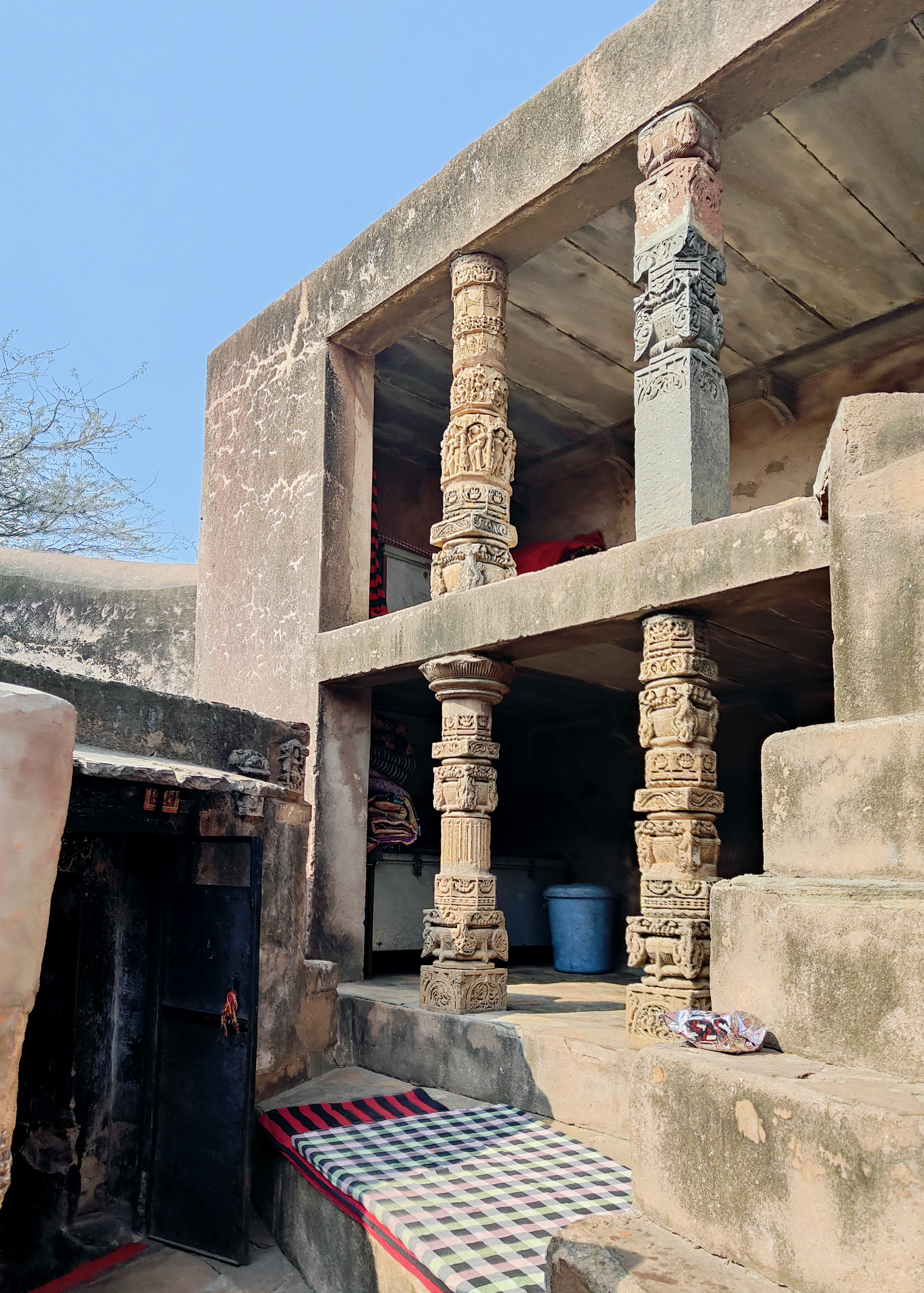 Various late mediaeval and modern structures within the compound of the Harsha Bhairon shrine reused several pillars dating back to the 10th century CE. The walls of the compound also featured several sculptures.