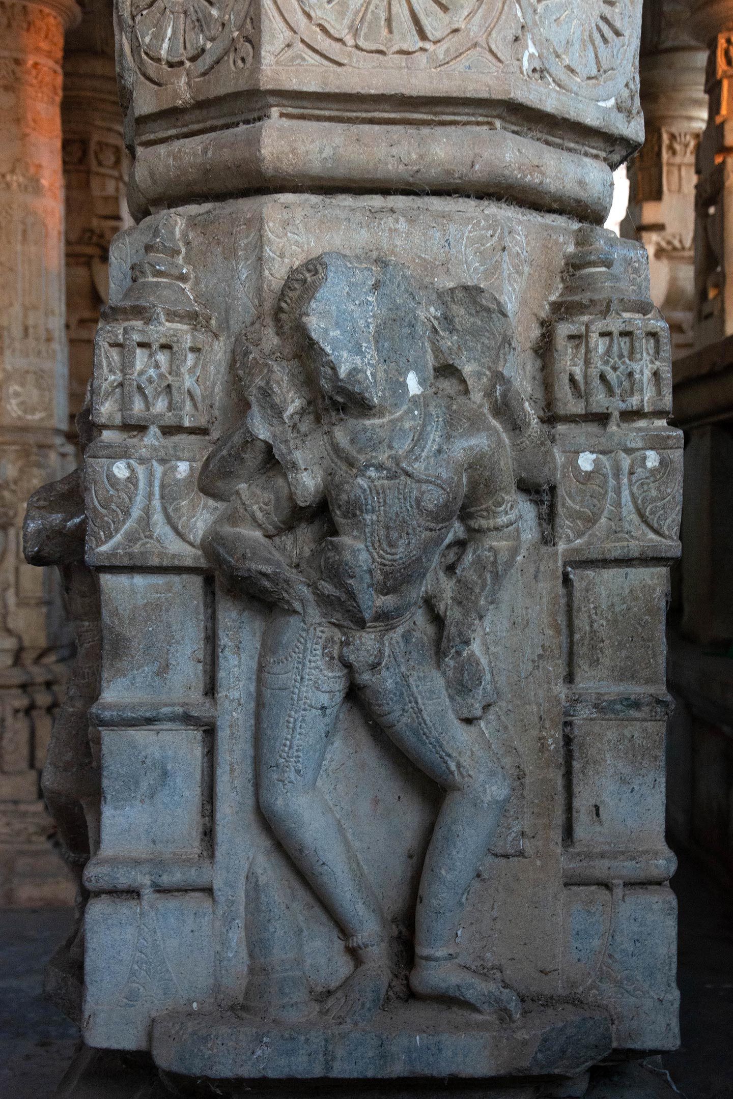 Image 8: The only significant image depicting the divinity of Shiva is a four-armed portrayal of Bhairava on a temple shaft near the entrance of the temple, in the mandapa, and is practically the first religious image one encounters when visiting the temple. He wears the necklace of a serpent, but other identifying attributes have deteriorated over time.