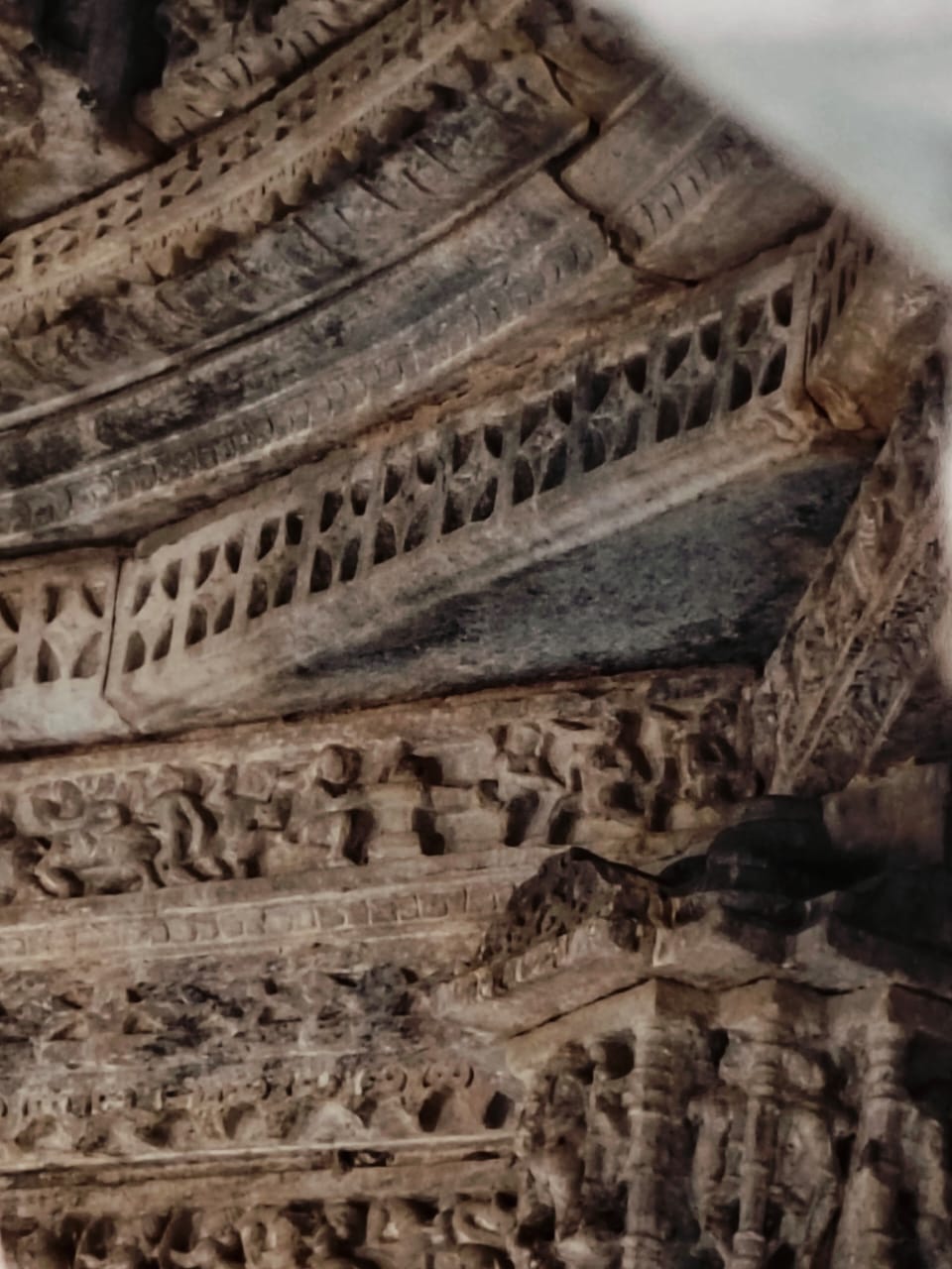 Image 9: Devotees worshipping Shiva linga are depicted on the carved beam of the ceiling in the mandapa of Bisaldeo Temple.