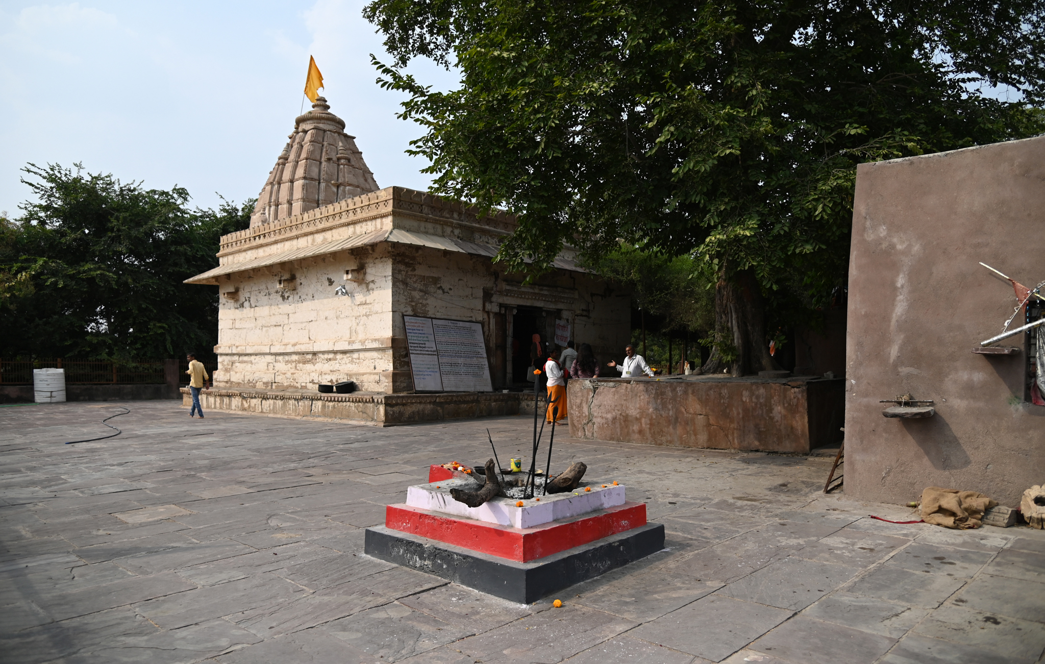 Image 1: Southeast view of the mulaprasada (main temple). Comprising a mandapa (hall), antarala (vestibule or antechamber), and garbhagriha (sanctum sanctorum) on its plan, the temple has a simple elevation with minimal decoration. Outside the main temple, there is a yajnakund for performing yajna and havan (fire rituals).