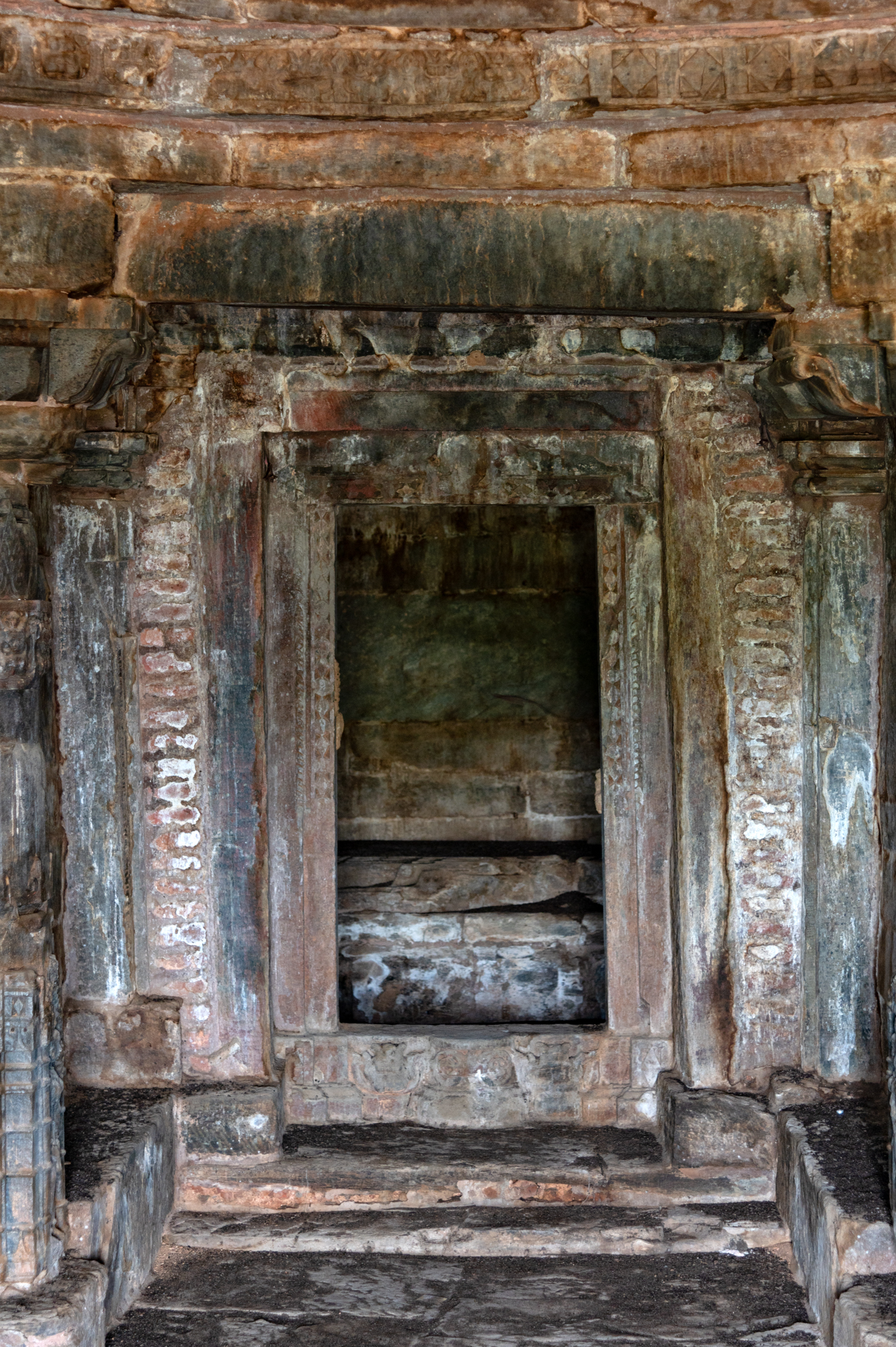 A simple brick-renovated dvarashakha (door jamb) defines the entrance into the Jain Temple's garbhagriha (sanctum sanctorum). The temple's garbhagriha is currently empty. The original object of worship is not known, and currently too, the temple is not under worship.