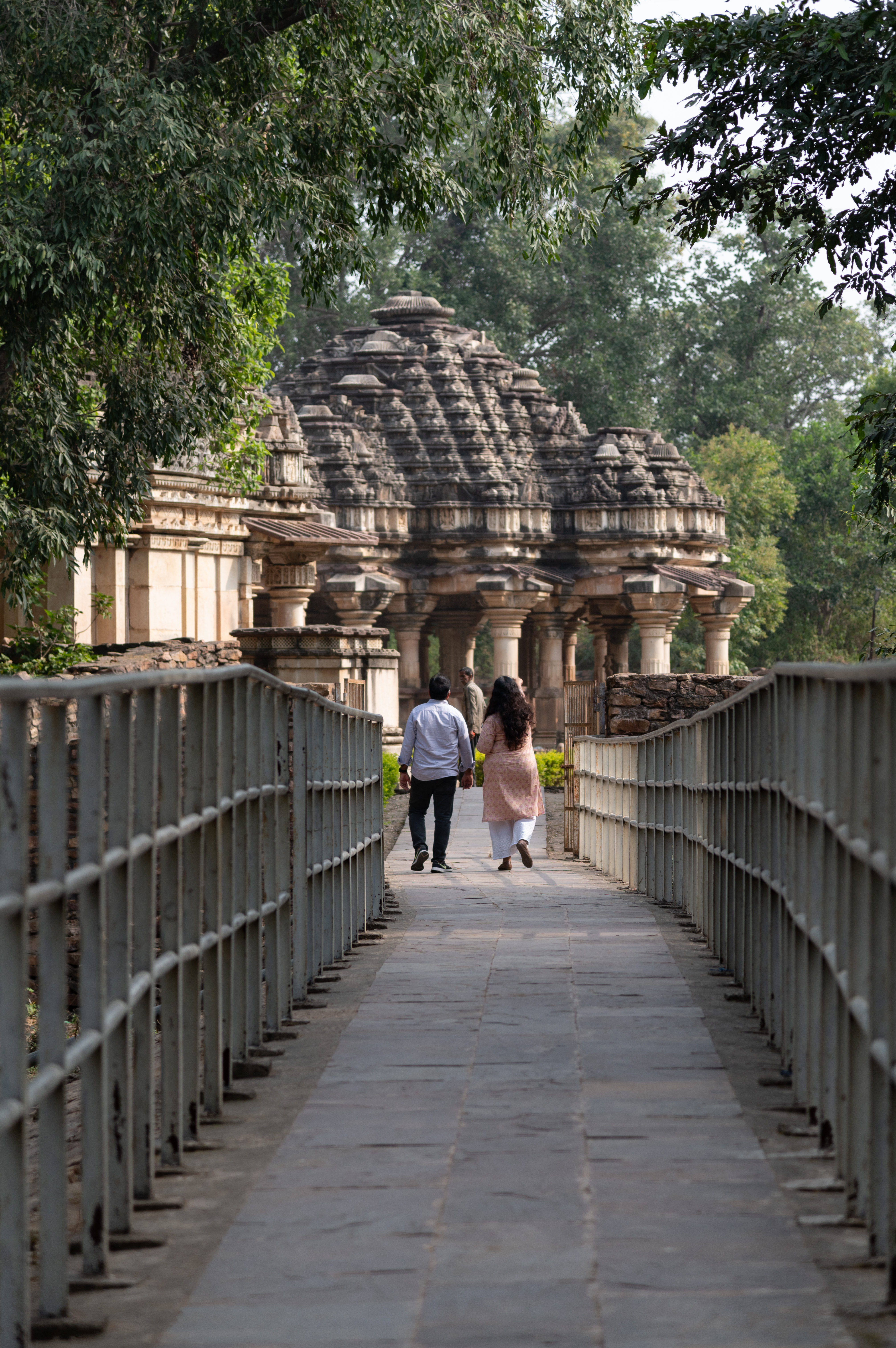 The Ghateshwar Temple is part of a group of eight temples known as the Baroli group of temples. There are two clusters in the complex. The first cluster is situated near the present entrance to the complex, provided by the Archaeological Survey of India (ASI). The second cluster, which includes the Ghateshwar Temple, is situated at the backside of the complex. A causeway leads to the second cluster, from where a glimpse of the Ghateshwar Temple can be seen.