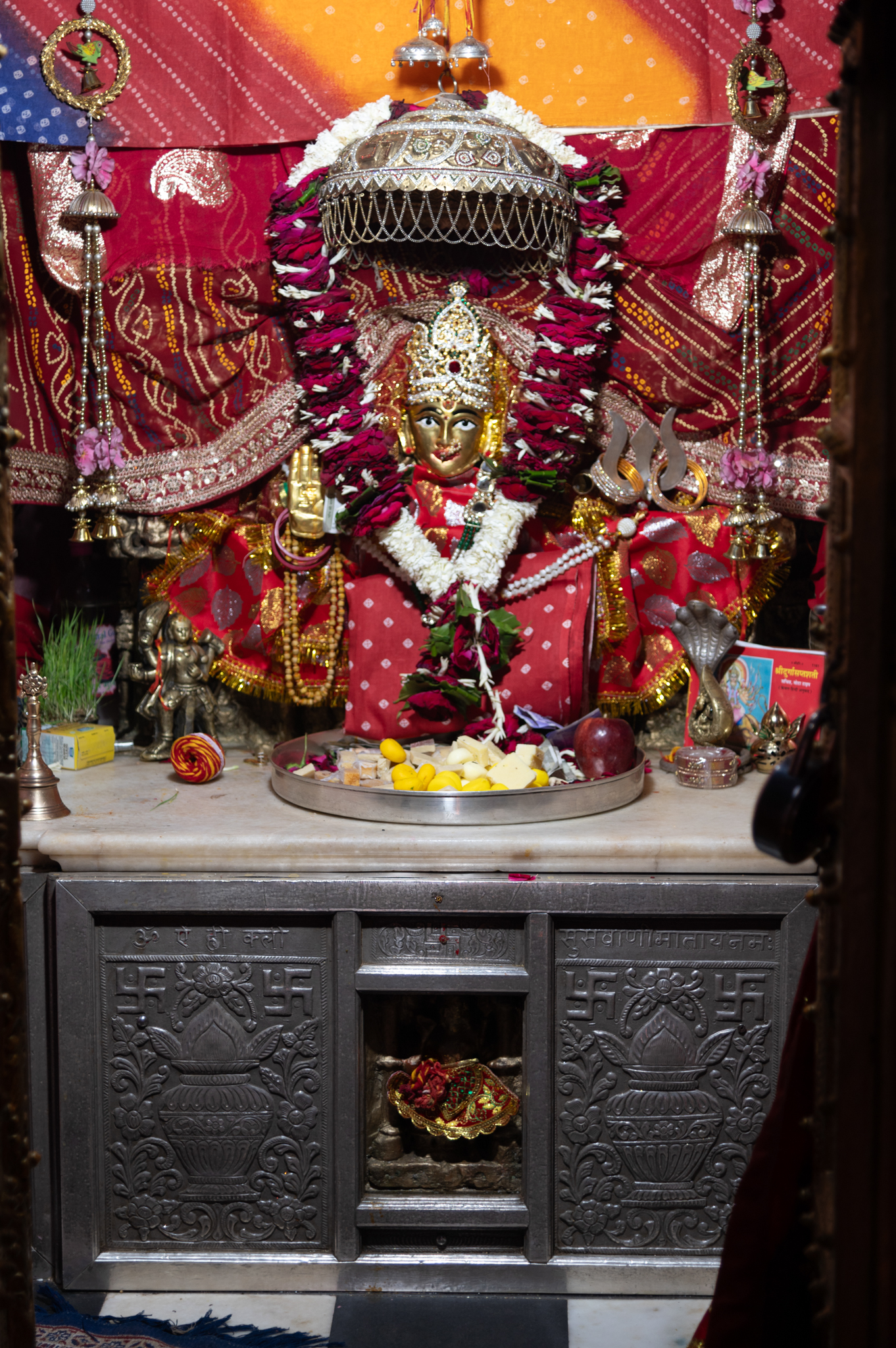 Main shrine image of Suswani Ma inside the garbhagriha (sanctum sanctorum) of the Suswani Mata Temple. The figure, covered in drapery, is shown seated on a rectangular pedestal.