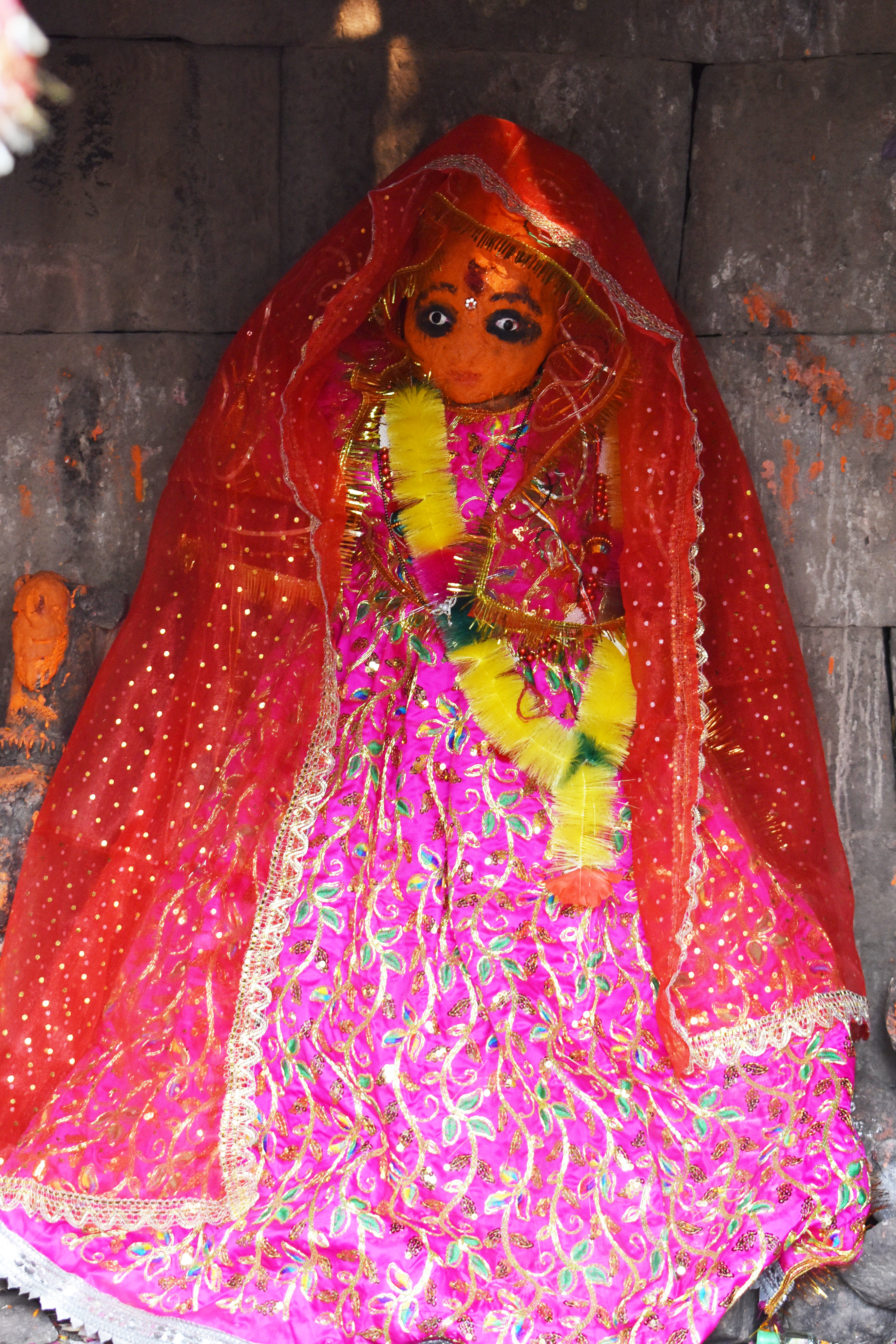 Image 22: Draped in clothes the Mahishasuramardini sculpture is housed inside the garbhagriha (sanctum sanctorum) of Mahishasuramardini Temple (Temple 9), Baroli group of temples.