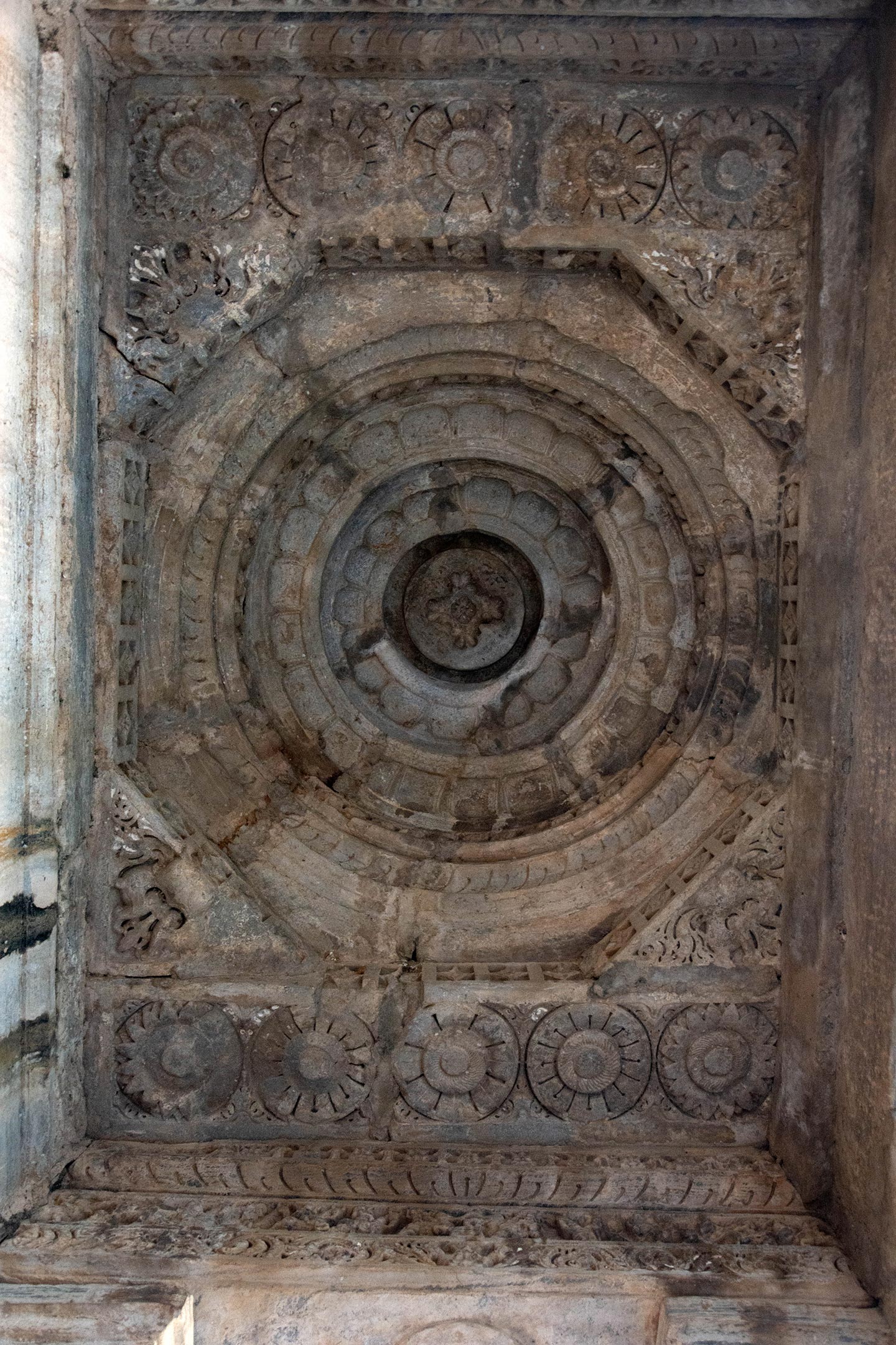 The ceiling of the mukhamandapa (front porch) is of the nabhichhanda variety, featuring five bands of concentric overlapping circles carved with lotus petals.