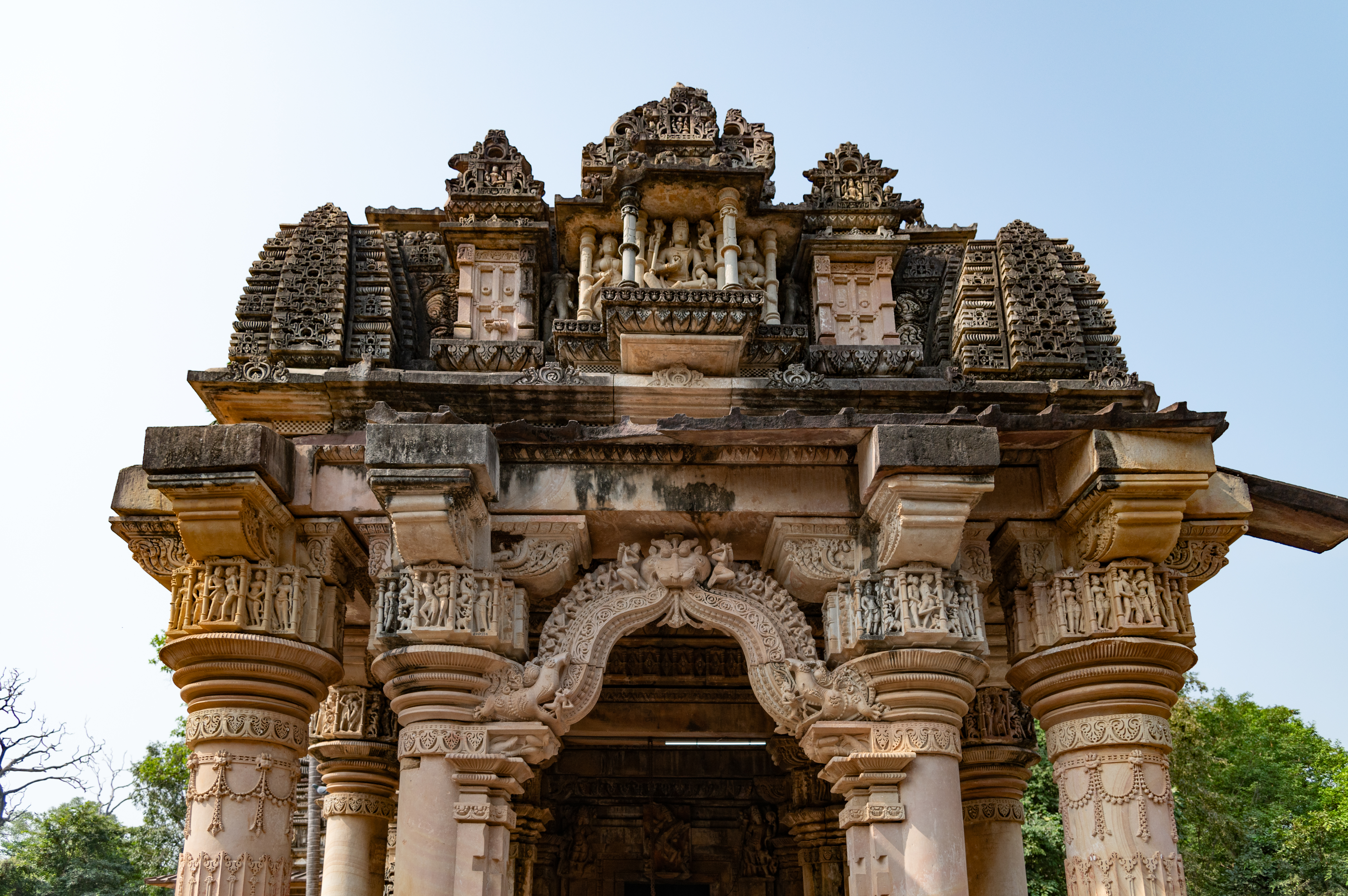 Image 8: Details of the makara torana (ornamental archway flanked by crocodile-like mythical creatures at both ends) and frontal pediment of the shikhara, of the mukhamandapa (front porch), Ghateshwar Temple.