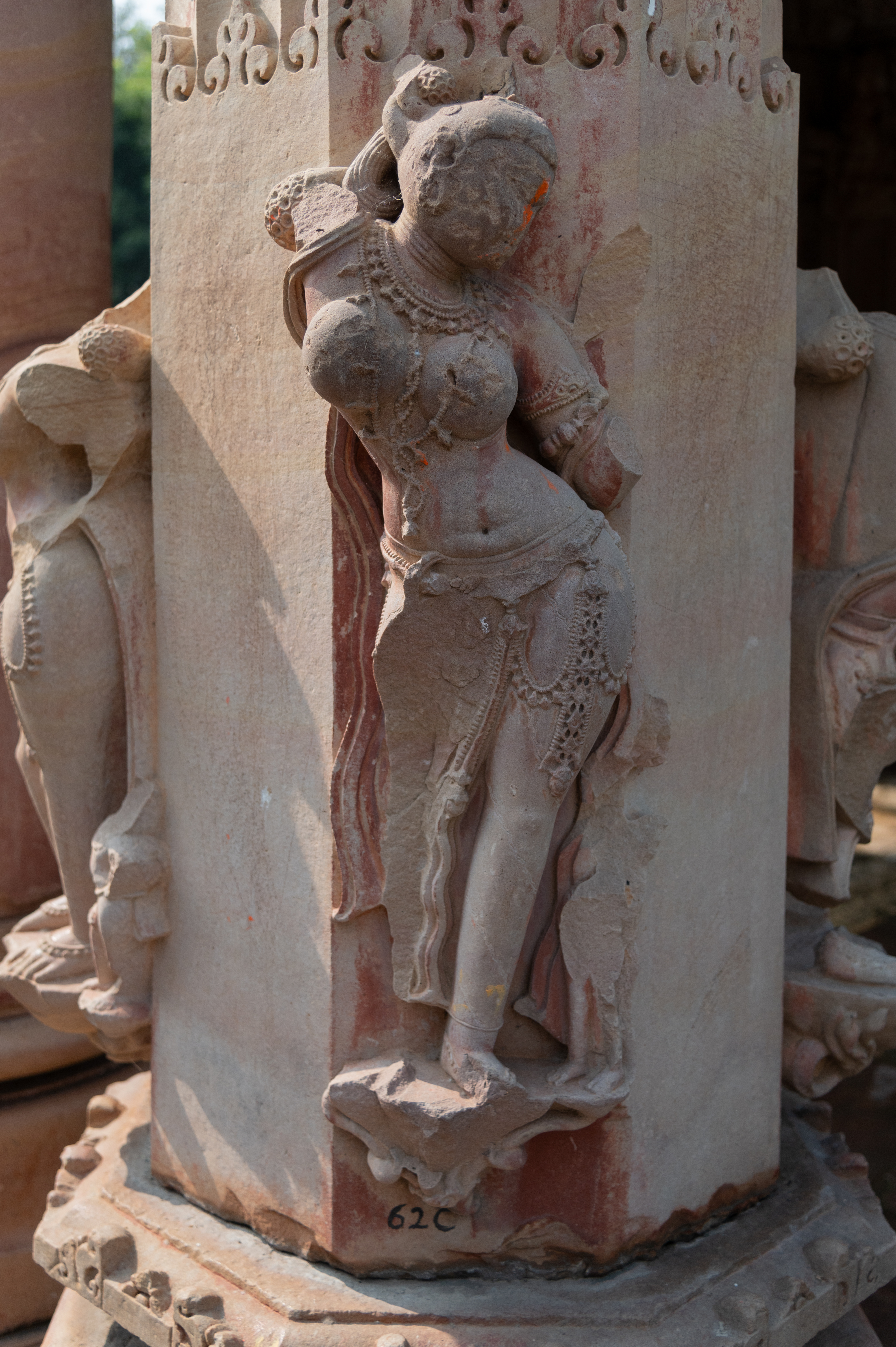 Image 10: Damaged Surasundari (celestial damsel) figure on the pillar of the mukhamandapa (front porch), Ghateshwar Temple.