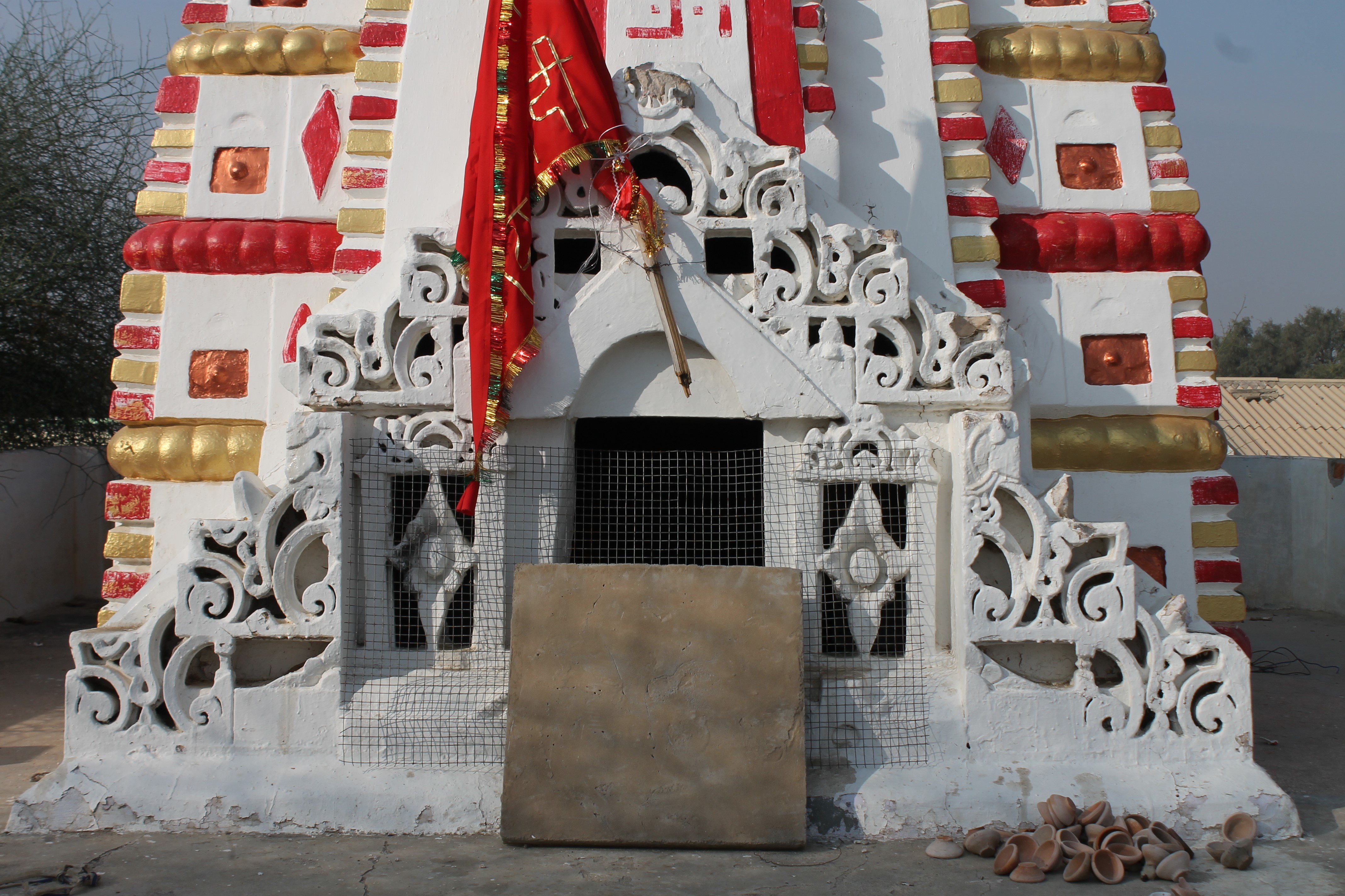 View of intricately carved details of a medallion of the shikhara (superstructure) of the Suswani Mata Temple, which is at the bottom of the shikhara. The design is composed of the gavaksha (dormer window) designs and diamond motifs.