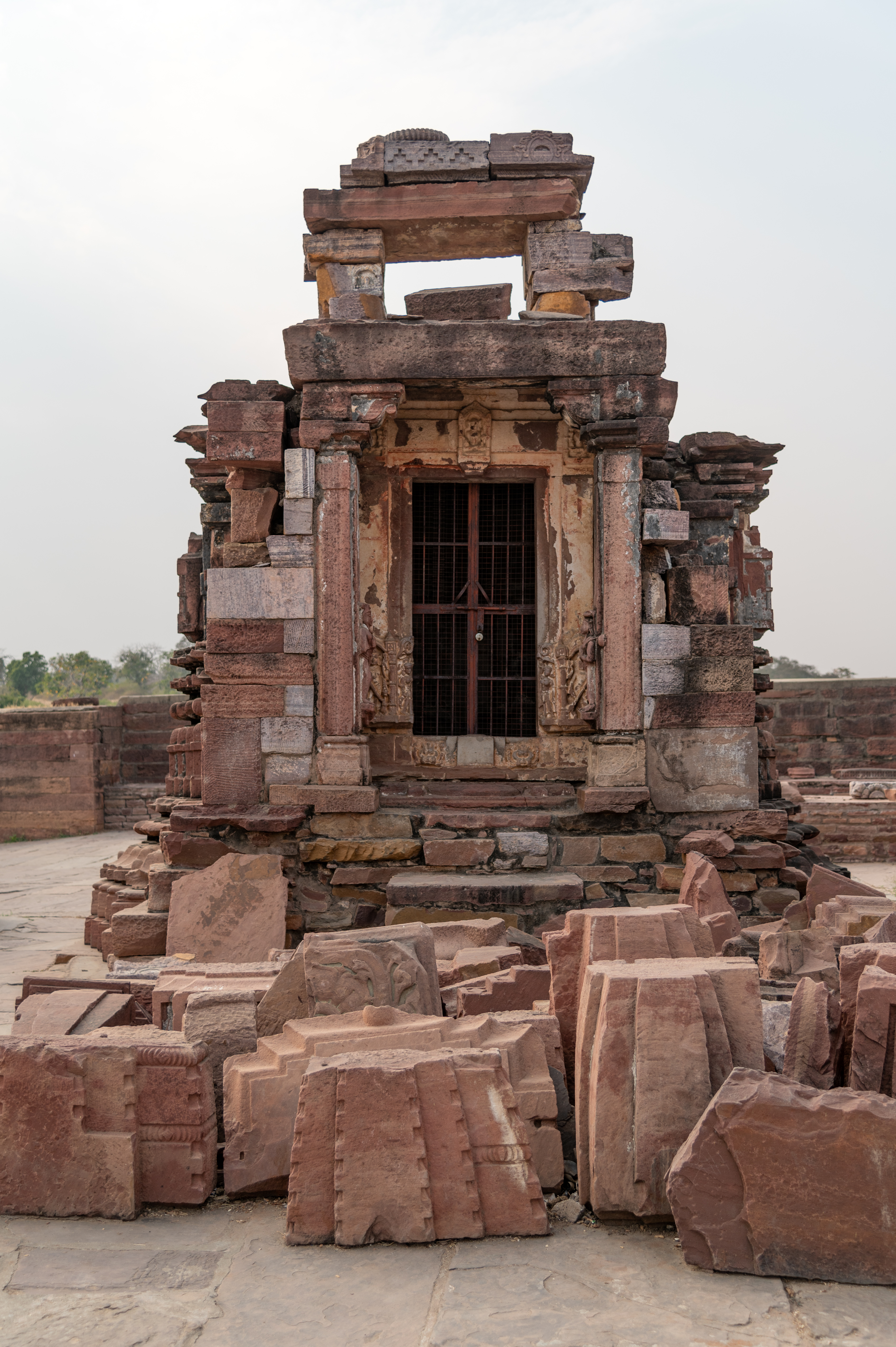 This is the front elevation of the temple with the shekhari shikhara in the Mahanaleshwar temple complex. The temple is in ruinous condition. The architectural fragments of the temple can be seen here, lying in the vicinity of the temple. The mandapa (pillared hall) of the temple has fallen, leaving behind only the outer stone frame.