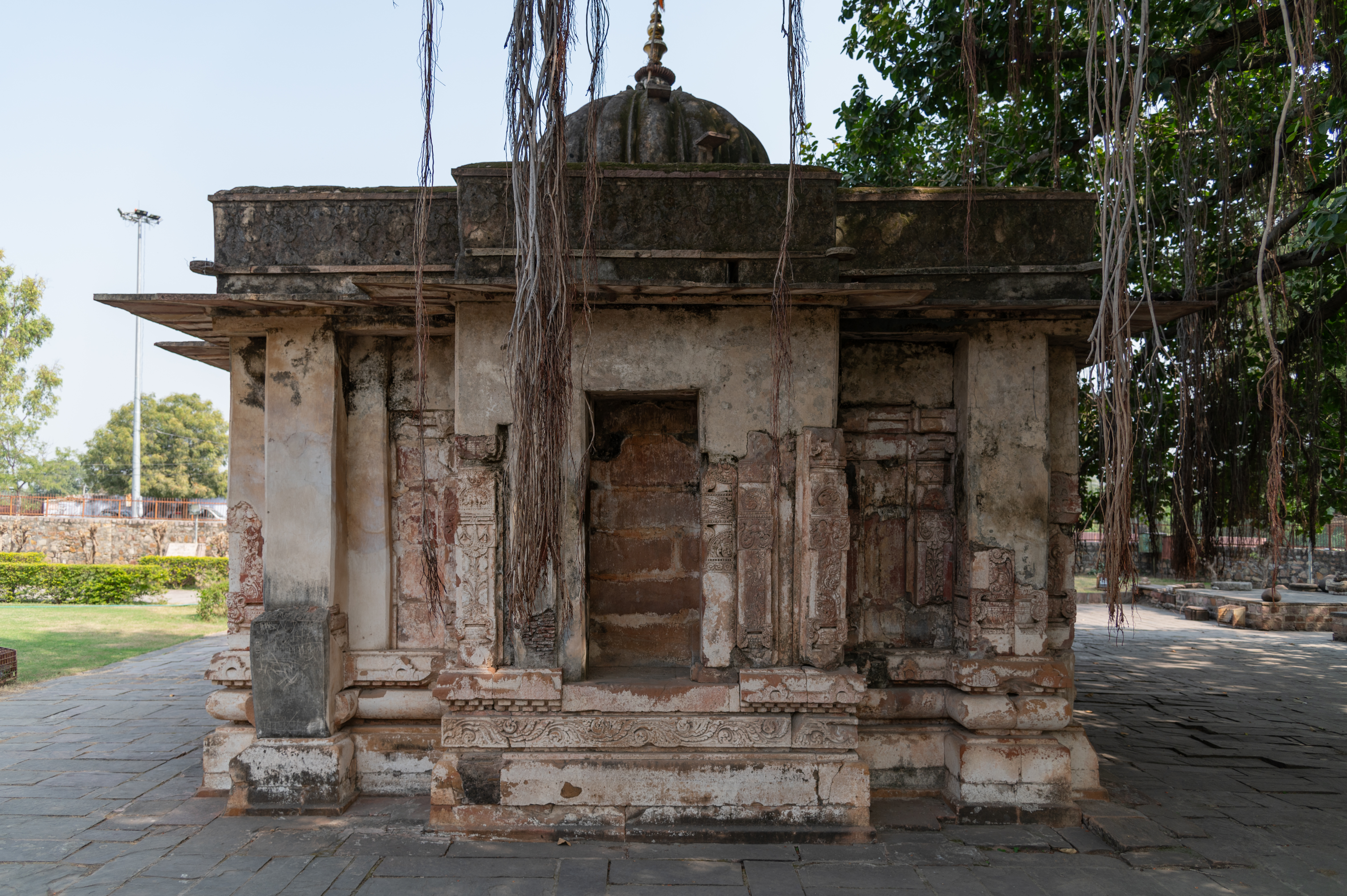 This is a rear view of the Sitaleshwar Temple in the Chandrabhaga temple complex. The temple's jangha (wall) has bhadra (central projections or offsets) on all three sides, which are comparatively larger than other temples of that period. Currently, the sculptures of deities that once occupied these spaces remain empty.