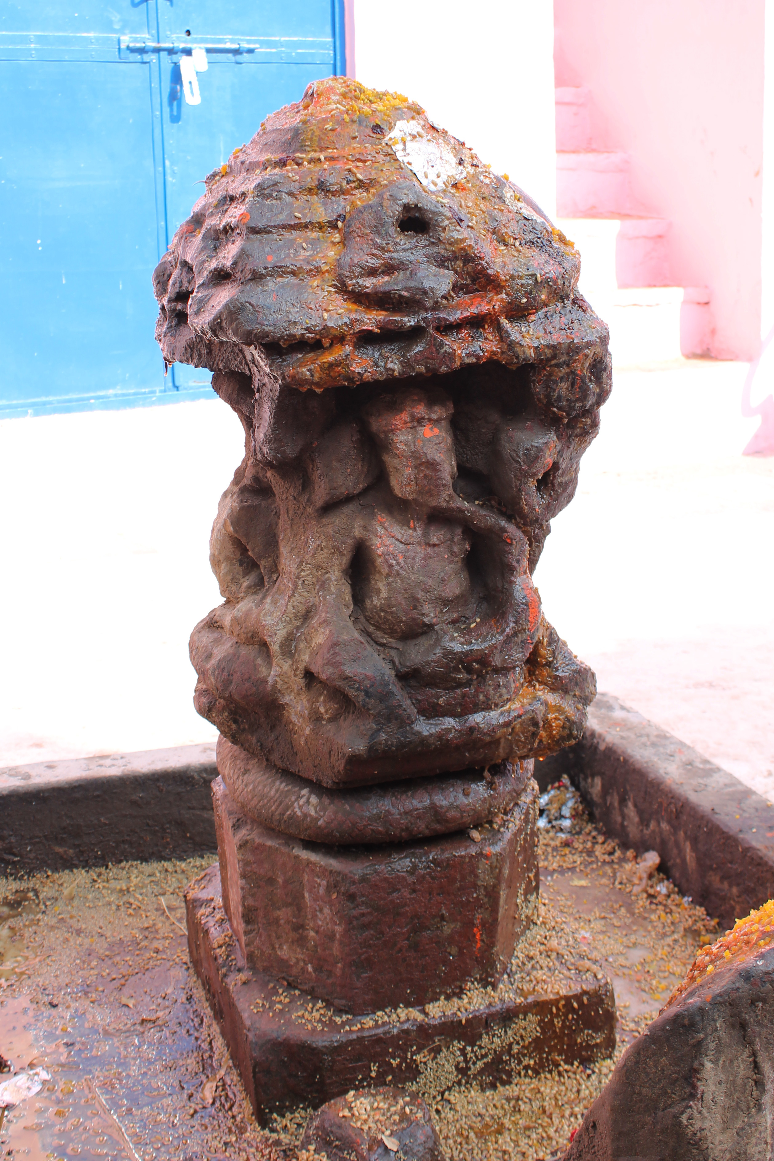 Seen here is another face of the sarvatobhadra (open from all sides), which features a depiction of a Ganesha icon. The four-handed image is depicted in a sitting posture, although the specific attributes of the icon are difficult to identify. The niche containing the Ganesha icon is topped by a pyramidal shikhara (superstructure). The Ganesha icon is characterized by long elongated ears, and the trunk curls up to rest on a bijapuraka (citron fruit).