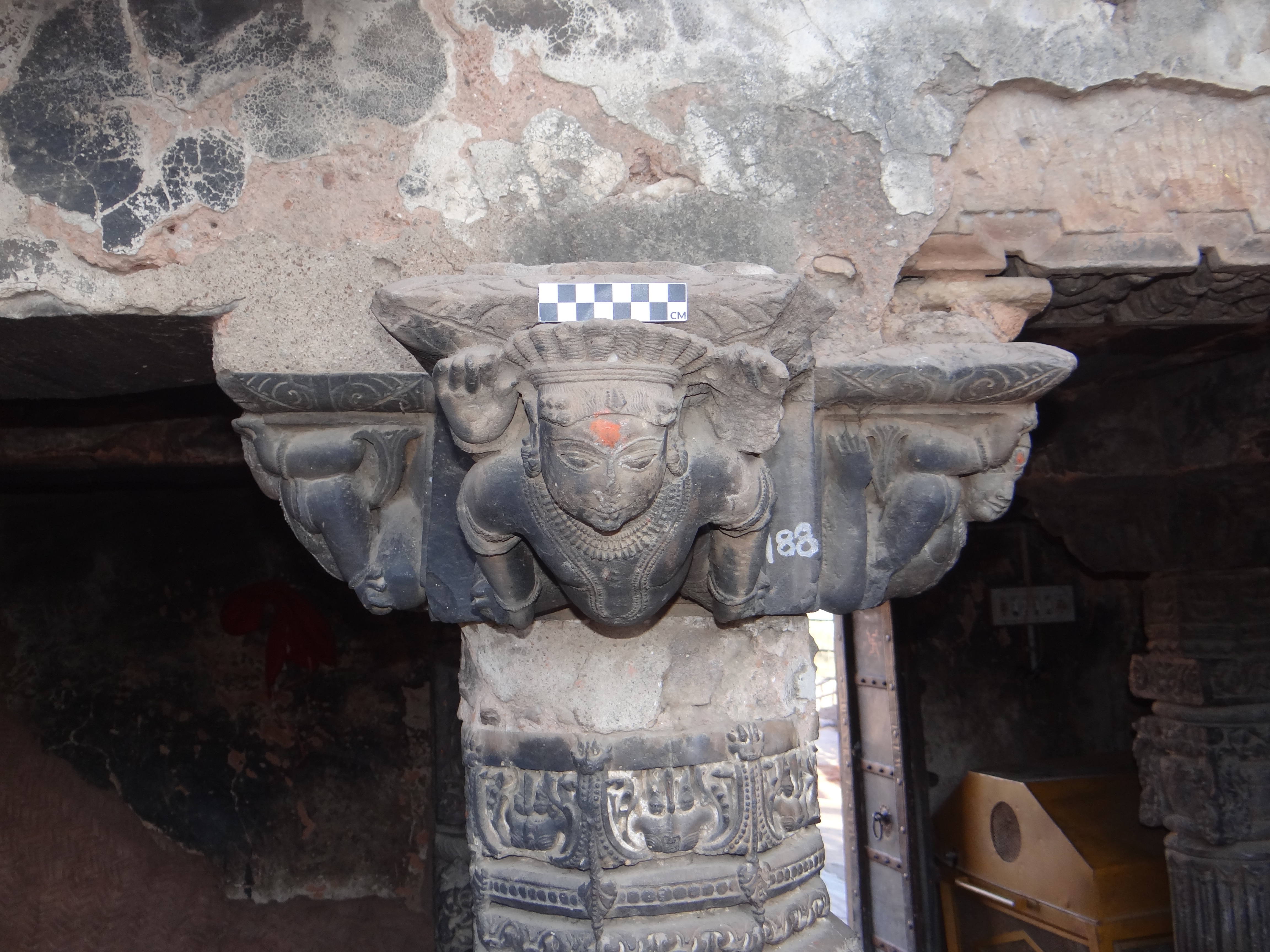 The centimetre grid scale is placed on the pillar capital to record the proportion of the carvings, Harshnath Temple Complex, Sikar district, Rajasthan. (Image courtesy: Mrunal Nidadavolu)