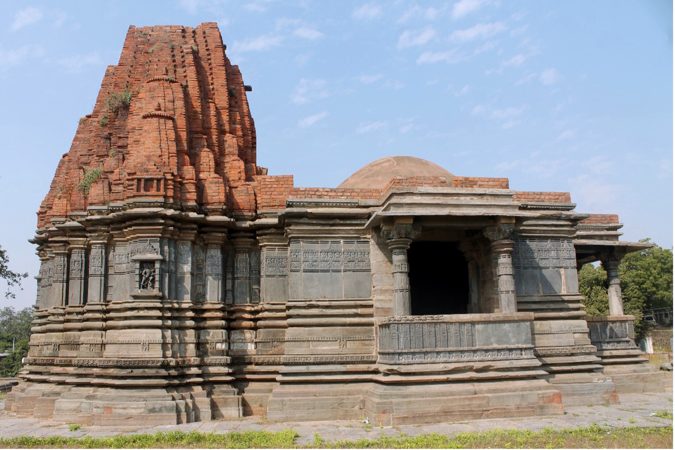 Image 2: North-facing elevation of the Mandaleshwar Mahadev Temple, which has the main temple body built in stone and the shikhara in brick.