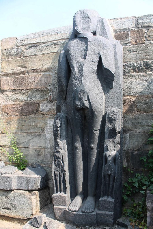 Image 1: At Arthuna, a mutilated Jain statue in the Jain Temple remains. The pedestal of the statue bears inscriptions.