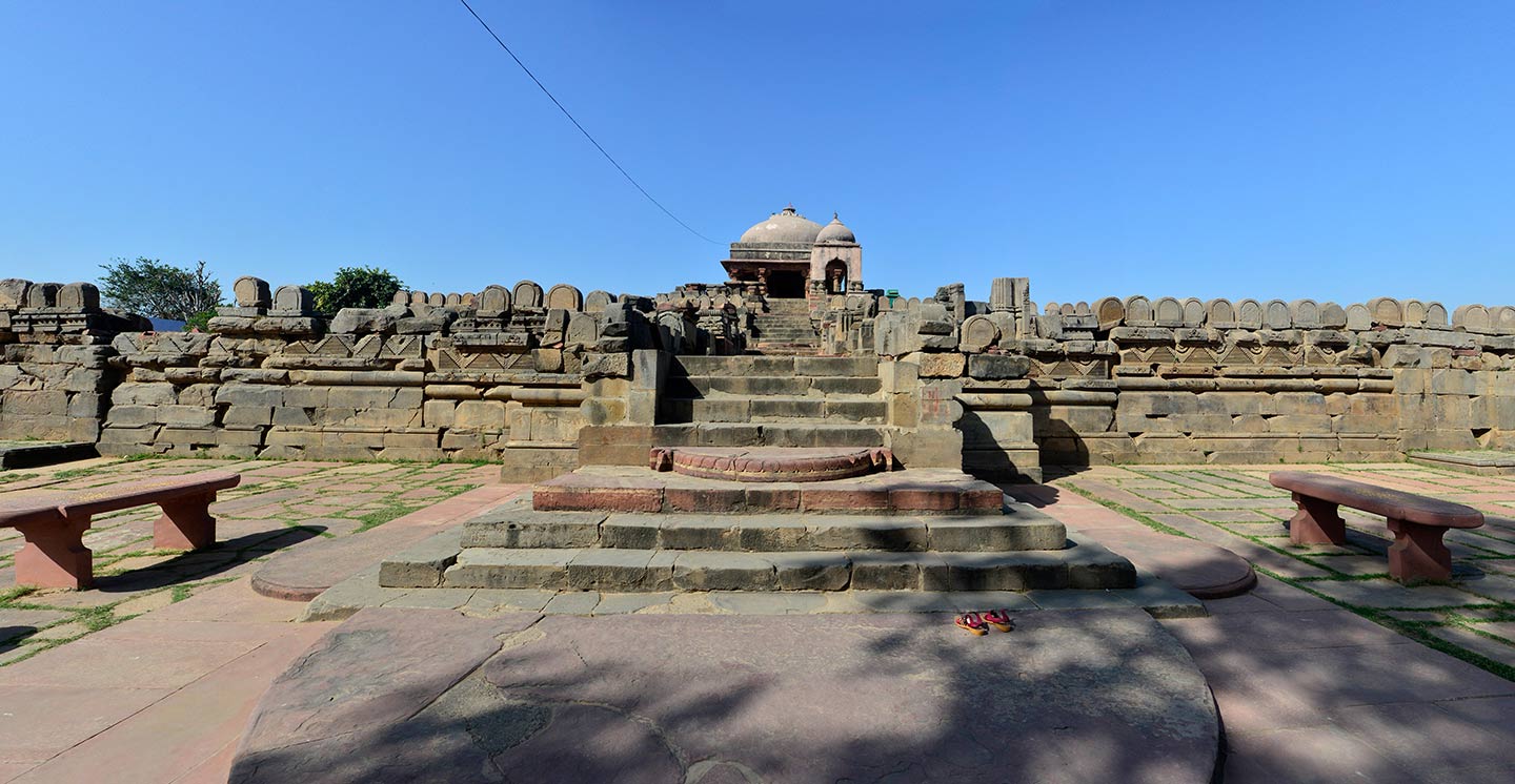 Moonstone and steps leading up to the first level of the Harshatmata Temple are visible from the approach, specifically from the east side coming from the Chand Baori.