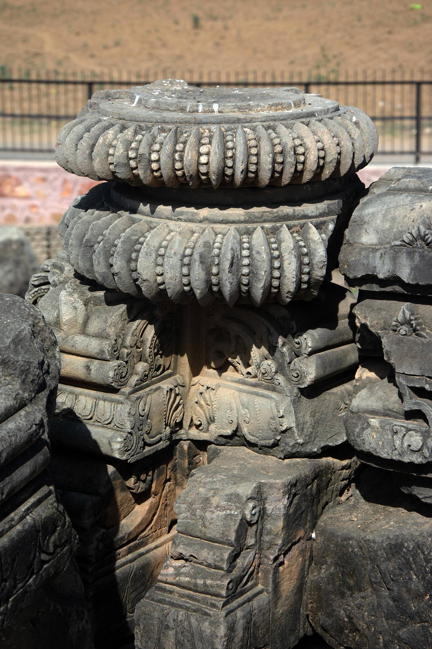 Most fragments assembled here were once part of the shikhara of the original temple, other subsidiary structures, and associated parts like the amalaka (notched disc), as seen here.