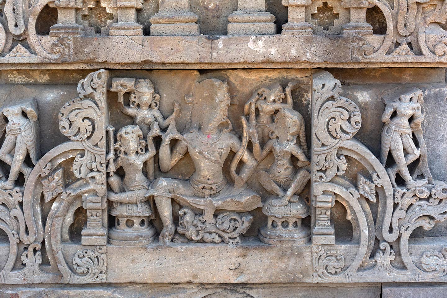 Image 2: This panel depicts Pradyumna. While Meister identifies the sculpture as Varuna, the god of oceans and the dikpala of the west direction, Packert-Atherton identifies him as Pradyumna, one of the Vrishni cult deities of the Pancharatra sect. Pradyumna sits in the lalitasana posture atop his mount, the mythical sea creature known as Makara. Four female attendants surround him, and he holds a bow in his left hand.